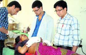Kamla Devi, who fought and killed a man-eating leopard, being treated at Srinagar hospital in Rudraprayag district on Sunday