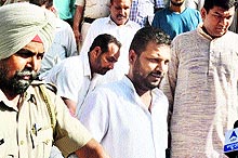 Dilbagh Singh, councillor (centre), who is under arrest, being escorted to the court in Amritsar on Tuesday
