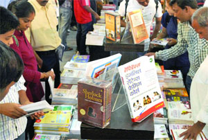 A huge gathering at a book stall during the 20th Delhi Book Fair at Pragati Maidan in New Delhi on Tuesday.