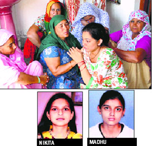 Women grieve at Madhus house in Rohtak. The girls bodies were cremated on Tuesday
