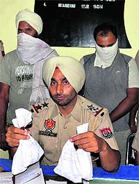 Christian Movement Punjab presidents son in police custody in drug peddling case in Jalandhar on Tuesday.