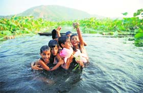 Having a splash: Children bathe in the Mansbal Lake