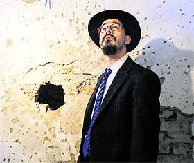 A rabbi looks at the ceiling of a room during the reopening ceremony of Nariman House in Mumbai on Tuesday. 
