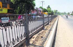 The road divider with the iron railing on the airport road in Amritsar with no gap for taking a U-turn