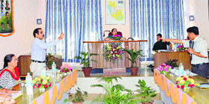 Councillors debate over issues during a general house meeting of the Municipal Council in Mandi on Tuesday.