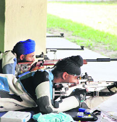 Shooters participate in the state shooting championship at the Punjab Police campus in Jalandhar on Wednesday.