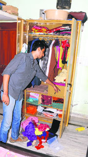 The victims son shows a ransacked almirah at his house in Model Town, Ludhiana.