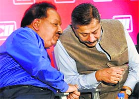 Union Health Minister Harsh Vardhan with CII National Committee on Healthcare Chairman Naresh Trehan at the 8th Health Insurance Summit in New Delhi on Wednesday