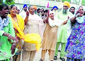 The wailing family members of the woman who allegedly died in police custody in Jandiala on Wednesday.