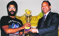 The principal of Mussoorie Public School felicitates television serial director Amandeep Singh in Mussoorie on Wednesday. A tribune photograph