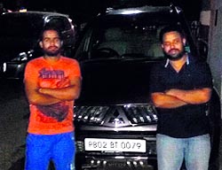 Local youngsters pose along with their car bearing a fancy number in Amritsar