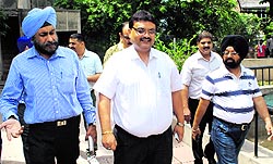 Municipal Commissioner Pardeep Sabharwal and other civic body officials leave the auction venue after finding hardly any bidders in Amritsar on Thursday