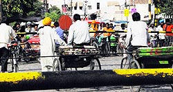 Rickshaw pullers risk their lives while crossing railway tracks in Amritsar