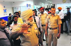 Policemen during a checking at the HDFC Bank in Bathinda on Thursday