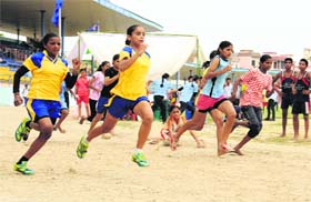Girl participants run in 800 m race in the District Rural Sports Tournament in Bathinda on Thursday