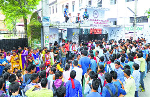 MCM DAV College students protest at the college gate in Kangra on Thursday.