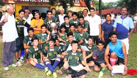 The winner Kasiga School team with the Principal Progressive School Association Football Tournament trophy at Gorkha Military School in Dehradun on Thursday.