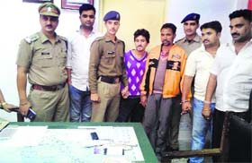 Alleged robbers in the custody of the police in Mussoorie on Thursday.