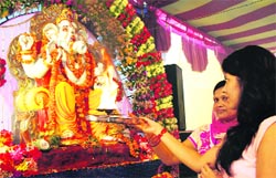 Women pay obeisance to Lord Ganesha on the first day of the Ganesh Chaturthi festival in Amritsar on Friday. Photo: RK Soni