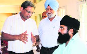 Special Health Secretory Vikas Garg interacts with a patient at the drug de-addiction centre in Bathinda on Friday.