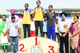 Colonel (retd) Dalwinder Singh (black turban) honours the winners of the 100m race in the District Rural Under-16 Sports Tournament in Bathinda on Friday.