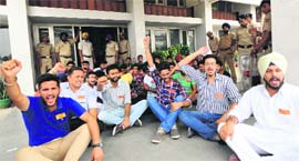 Workers of student parties stage a dharna at the UIET against the rejection of nomination papers of candidates at Panjab University on Friday. Later, the papers were accepted. 