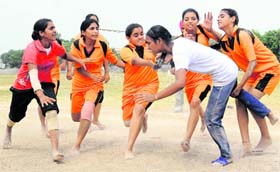 The kabbadi final between Kartarpur (in orange) and Dhanoli in progress during the U-16 District-Level Rural Sports Tournament at Government College in Phase VI, Mohali, on Friday.