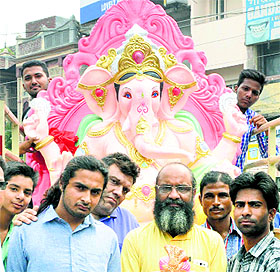 On the ocassion of Ganesh Chaturthi, devotees take home an idol of Lord Ganesha in Jalandhar on Friday.