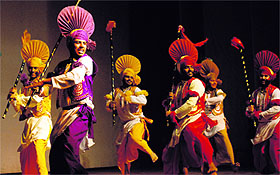 Students of the APJ College of Fine Arts perform bhangra during the Tech Fest-2014 in Jalandhar on Friday.