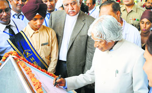 Former President Dr APJ Abdul Kalam writes a quote at Satya Bharti Adarsh Senior Secondary School, Sherpur Kalan, Ludhiana, on Friday.