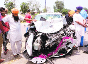 The mangled remains of the car that met with an accident near Khanna on Friday. 
