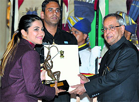 President Pranab Mukherjee presents the Arjuna Award to shooter Heena Sidhu on the National Sports Day at the Rashtrapati Bhawan on Friday.