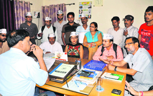 Members of the Aam Aadmi Party protest at the Nehru Colony Jal Sansthan office in Dehradun on Friday.