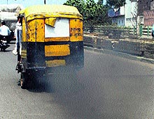 Vehicles emit smoke on a road polluting the environment merrily in Amritsar on Saturday