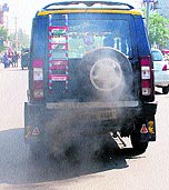 Vehicles emit smoke on a road polluting the environment merrily in Amritsar on Saturday