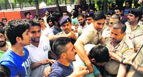 Students scuffle with the police during a protest at the PG Government College, Sector 11, in Chandigarh on Saturday