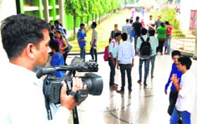 A videographer captures the activities of students at DAV College, Sector 10, on Saturday