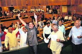 Legislators protest against the land scam in the Assembly in Srinagar on Saturday