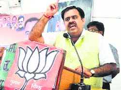 BJP national secretary Tarun Chugh addresses party workers.