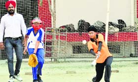 A match in progress during the Ludhiana District Baseball Championship at the Guru Nanak Khalsa College for Women on Saturday.