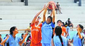 A player tries to basket the ball during the Punjab Youth Basketball Championship at Guru Nanak Stadium in Ludhiana on Saturday.