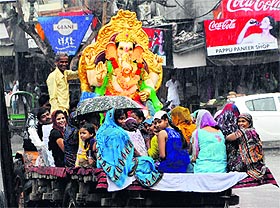 Devotees take an idol of Lord Ganesha for immersion after the celebration of Ganesh Chaturthi in Amritsar on Sunday.