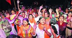 residents dance to the tunes of a religious song