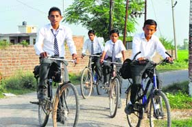 Boys pedal their way to school in the RS Pura sector of Jammu