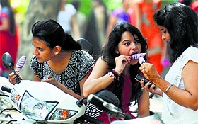 Girls enjoy ice-candies in Ludhiana.