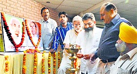 MLA Bharat Bhushan Ashu (lighting the lamp) inaugurates the VIIth Annual Mushaira at Punjabi Bhawan in Ludhiana. 
