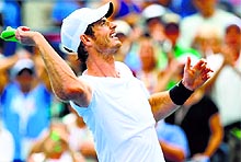 Andy Murray celebrates after defeating Andrey Kuznetsov of Russia in the third round