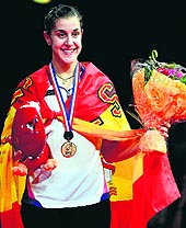 Carolina Marin of Spain poses after winning the womens singles final against Chinas Li Xuerui at the World Championships on Sunday