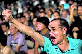 A protester shouts slogans at a pro-democracy rally next to the Hong Kong government complex on Sunday.