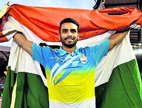 Arpinder Singh celebrates his victory in the Commonwealth Games